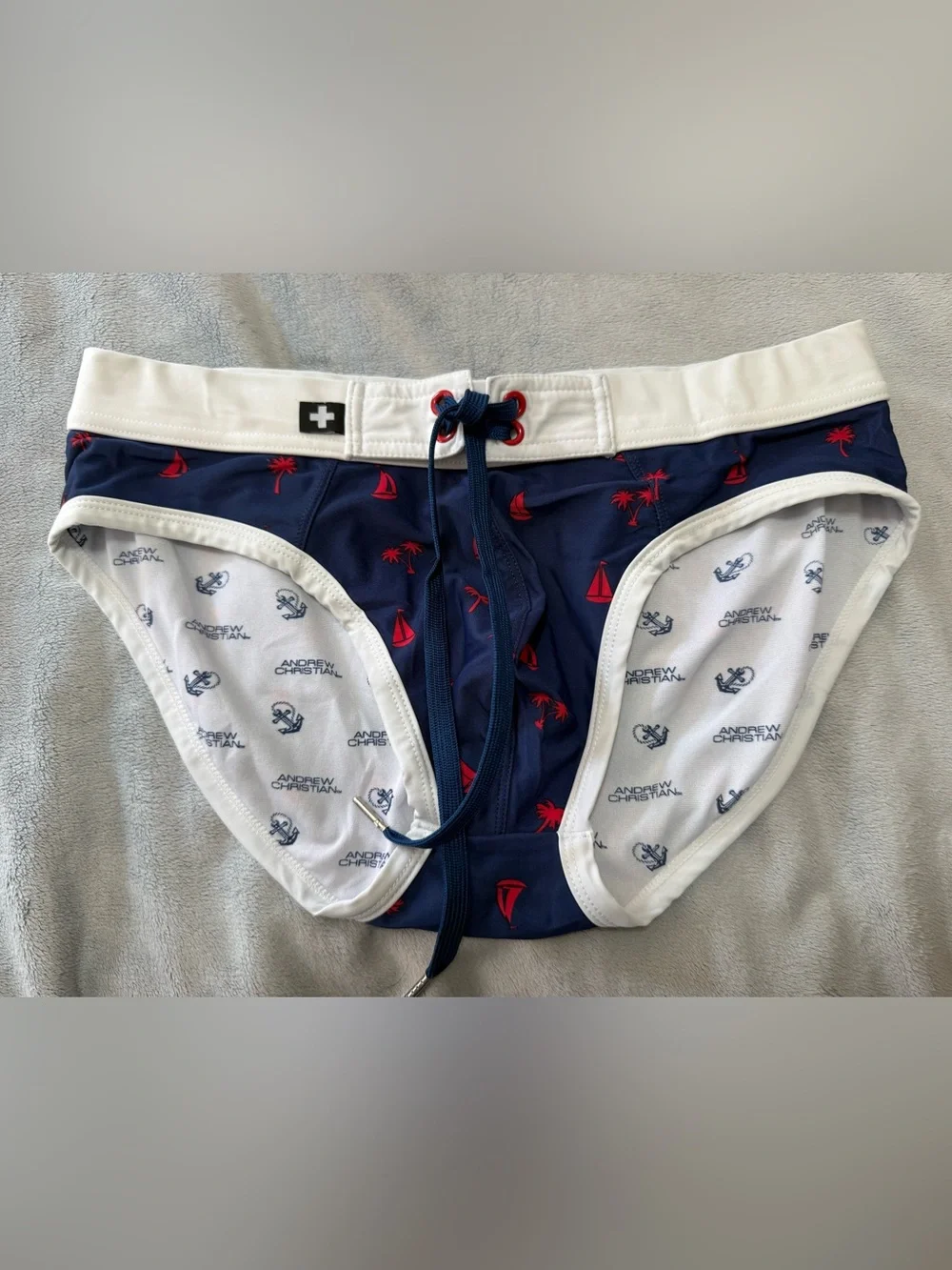 Andrew Christian Men's Navy Blue Tropical Print lined Swim Briefs. Size large.